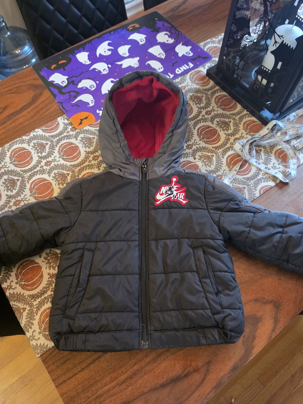 Nike Kids Black Puffer Jacket with Red Hood Lining
